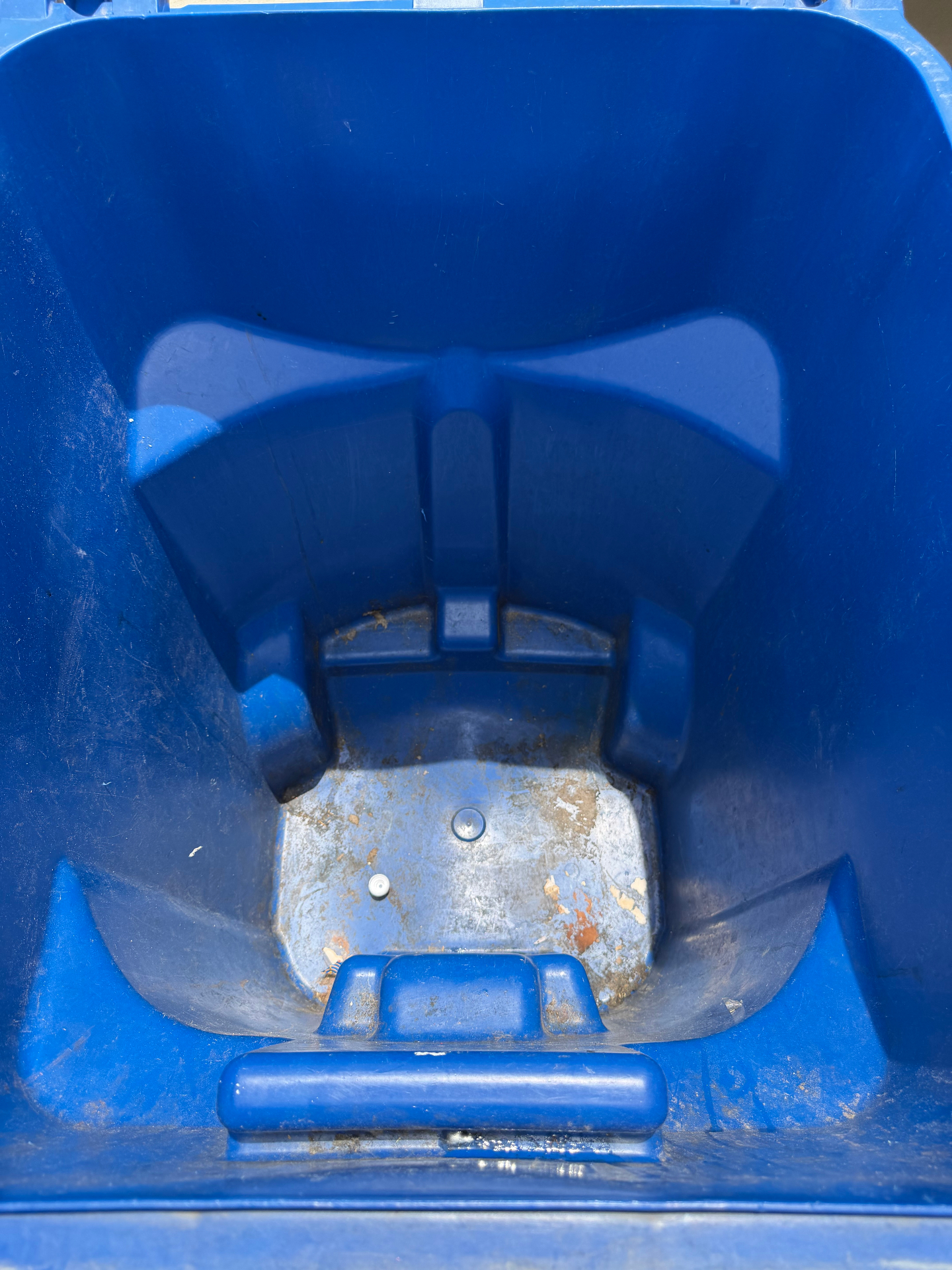 Recycling bin — sticky residue before cleaning